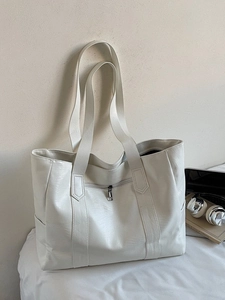 Minimalist white large capacity faux leather tote bag with shoulder straps for daily commute