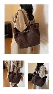 Detailed view of deep coffee vintage tote bag with retro belt buckle and shoulder strap
