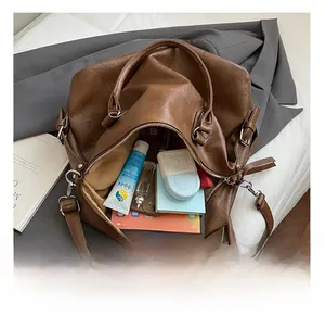 Detailed interior of the large brown tote bag showing its spacious capacity for daily items