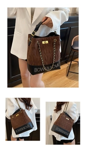 Detail view of the quilted bucket bag with chain strap and contrast leather patchwork