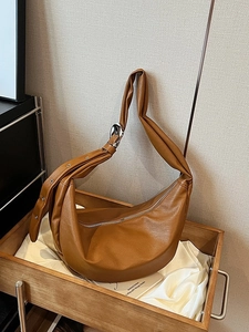 Retro caramel oil wax leather hobo bag with wide shoulder strap and silver hardware