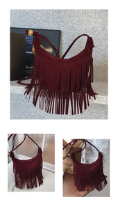 Detail of burgundy suede crescent bag featuring vintage long tassels and a wooden bead