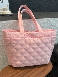 Pink quilted down tote bag made of lightweight nylon for daily commuting and casual use