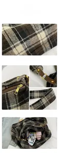 Detail view of large plaid tote bag interior capacity with metal zipper and hardware