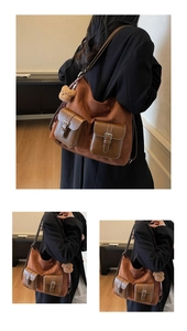 Detail view of vintage brown suede tote bag with front buckle pockets and plush bear charm