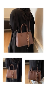 Detailed views of brown litchi pattern tote bag with dual handles and tassel charm