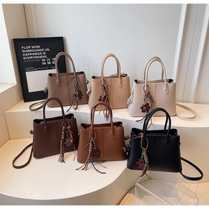 Group display of six minimalist large-capacity tote bags in various neutral leather colors