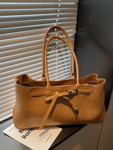 Retro brown faux leather tote bag with elegant buckle detail for commute and daily use