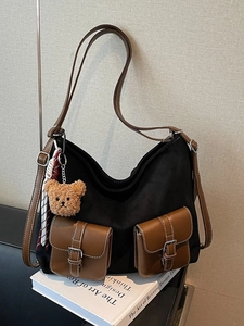 Vintage color-block tote bag with brown leather pockets and plush bear charm