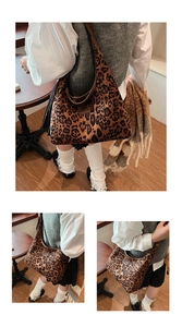 Macro detail of plush leopard print texture and sturdy leather handle on a hobo bag