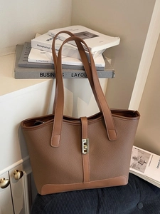 Brown litchi leather tote bag with gold twist lock and dual shoulder straps for women