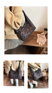 Close-up of leopard print canvas hobo bag with leather trim and brand logo detail