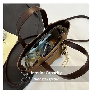 Top view of spacious interior of the brown canvas bag showing zipper pocket and essentials