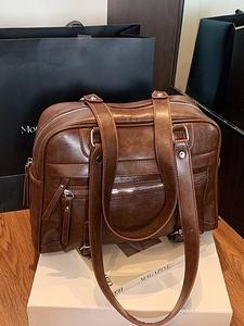 Retro dark brown Boston bag with multi-zipper compartments and long shoulder straps