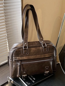 Vintage dark brown pillow tote bag with dual handles and distressed PU leather texture