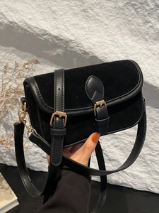 Minimalist black matte shoulder bag with velvet texture and vintage gold buckles