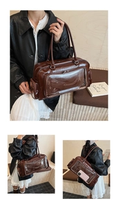 Detail of deep brown patent leather tote bag with transparent display window for decoration