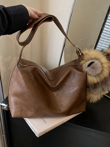 Vintage brown PU leather hobo bag with large capacity and soft plush charm accessory