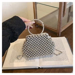Elegant silver handmade beaded handbag with circular metal handle and chain strap for women