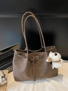 Retro large brown tote bag with long straps and cute dog charm for daily work commute