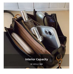 Macro shot of internal capacity showing multi-layered compartments with gadgets and accessories