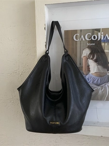 Classic black faux leather tote bag with a minimalist Hobo design and shoulder strap