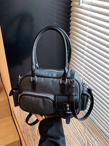 Dark grey nylon bowling bag with multiple pockets and adjustable shoulder strap