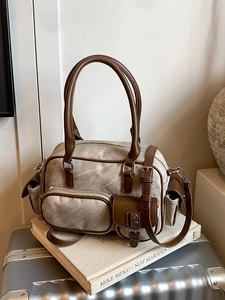 Retro canvas bowling bag with brown leather trim and multi-pocket functional design