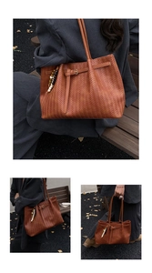 Detail of a brown woven leather tote bag with unique beaded charm and buckle accent