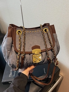 Retro suede shoulder bag with pleated details, chain strap and metallic lock closure