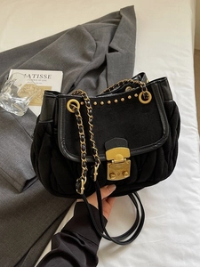 Chic black pleated shoulder bag with gold metal clasp and chain strap for women
