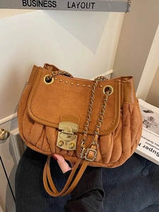 Brown pleated suede shoulder bag with gold metal clasp and chain strap in vintage style