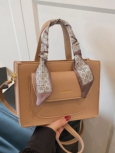 Brown lychee leather handbag with silk scarf handle and adjustable shoulder strap