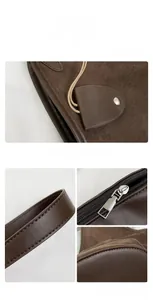 Détails de sac fourre-tout en daim marron foncé avec finitions cuir et fermeture
