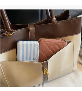 Détail du sac cabas vintage avec poche contrastée marron et rangement intérieur spacieux