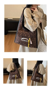 Detailed close-up of a leopard print canvas tote bag with yellow knot and fringe tassels