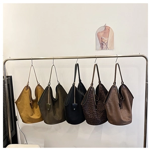 Selection of five retro tote bags in various colors including leopard print and mustard yellow