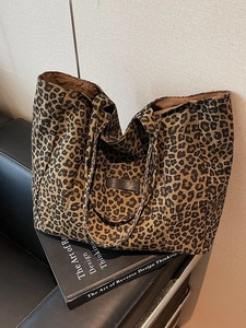 Large leopard print tote bag in canvas material on a sofa for autumn commute style