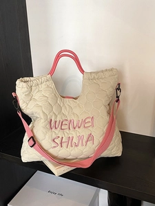 Sac fourre-tout matelassé beige avec poignées roses et broderie pour le travail