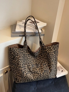 Chic leopard print canvas tote bag with front pocket and shoulder straps for daily use