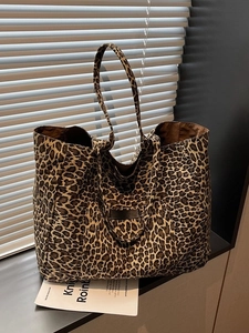 Large leopard print tote bag for women featuring canvas texture and double shoulder straps