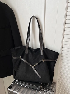 Minimalist black large capacity tote bag on silver suitcase for business travel