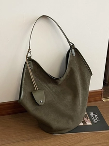 Large olive green suede hobo tote bag for women featuring smooth leather trim and minimalist style