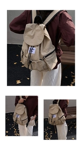 Détails du sac à dos en nylon beige avec cordon de serrage, zip latéral et étiquette