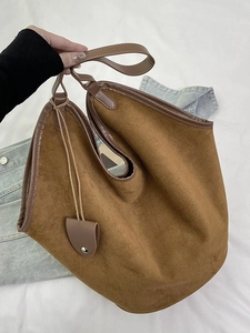 Retro brown suede tote bucket bag with leather handles in a Korean casual shoulder style