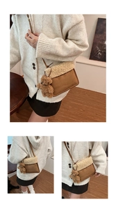 Detail of plush brown suede crossbody bag with fleece trim and cute bear charm