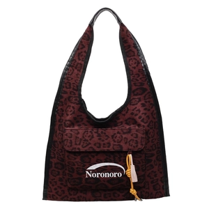 Burgundy leopard print canvas tote bag with black straps and fringe tassel charm