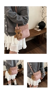 Detailed view of pink fleece crossbody bag with lamb wool trim and plush bear charm