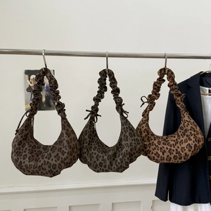 Three leopard print crescent tote bags with pleated handles in different brown tones