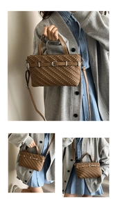 Detailed view of brown woven Boston bag with silver buckle and detachable shoulder strap
